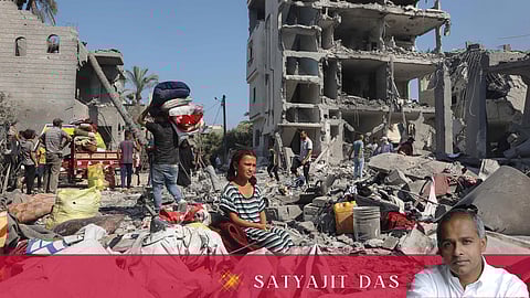 A Palestinian girl sits as people recover belongings in Deir el-balah in the central Gaza Strip, on August 7, 2024, following Israeli bombardment amid the ongoing conflict between Israel and the Palestinian Hamas militant group.
