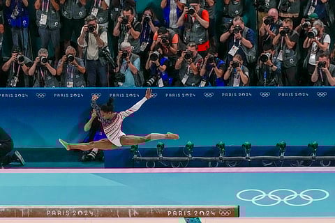Simone Biles, of United States, performs on the beam during the women's artistic gymnastics team finals at the 2024 Summer Olympics, Tuesday, July 30, 2024, in Paris, France.