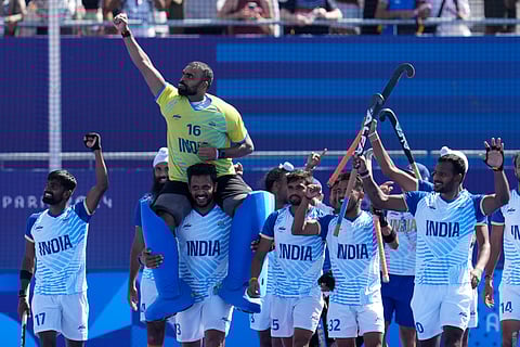 Goalkeeper PR Sreejesh celebrates with teammates after India won the men's hockey bronze medal match against Spain at the 2024 Summer Olympics, in Colombes, France, Thursday, Aug. 8, 2024.