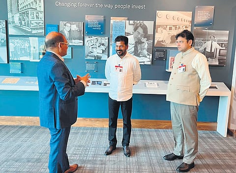 Chief Minister A Revanth Reddy and IT Minister D Sridhar Babu with a representative of Charles Schwab Corporation in Dallas on Thursday