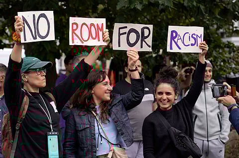 Protesters demonstrate against a planned far-right anti-immigration protest in London, Wednesday, Aug. 7, 2024 .