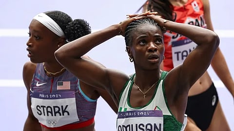 Nigeria's world record holder Tobi Amusan reacts after failing to qualify for the Olympic 100m hurdles final.