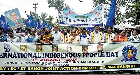 Tribals taking out rally in Malkangiri on Friday