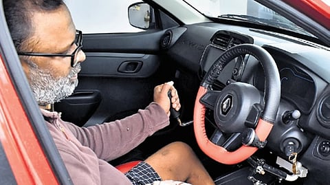 K Robin Benifer in the car which has been modified