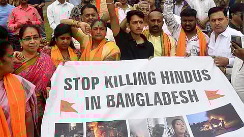 Hindu activists protest against killing of Hindus in Bangladesh violence in India.