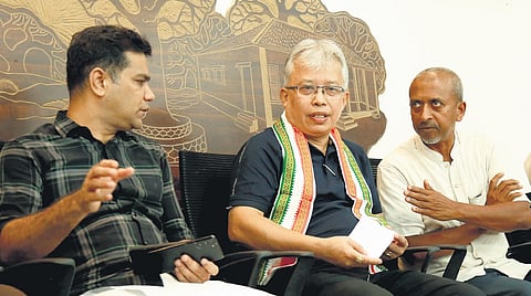 MP Hibi Eden shares a point with Manipur MP Angomcha Bimol Akoijam and Fr Augustine Vattoly during ‘Manipur Memoirs’ in Kochi on Sunday