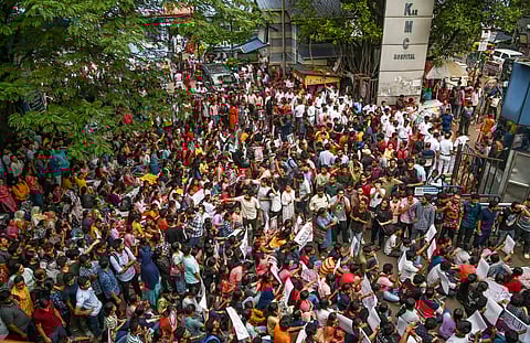 Junior doctors protest against the alleged rape and killing of a trainee doctor in Kolkata.