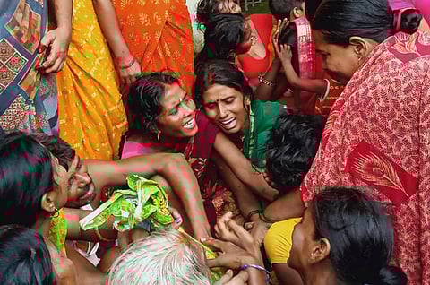 Family members of the victims mourn after a stampede at Baba Siddheshwar Nath Temple, in Jehanabad district, early Monday morning, Aug. 12, 2024. At least seven people were killed and 16 others suffered injuries, according to officials.