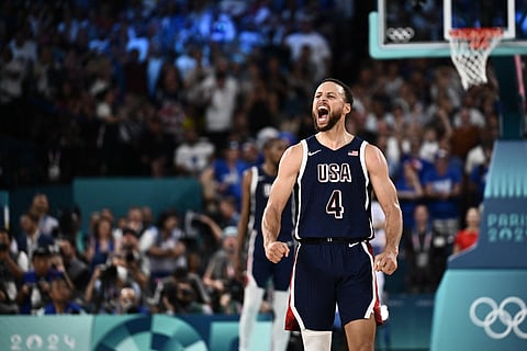 Team USA's Stephen Curry celebrates after scoring a three-pointer in the Olympics gold medal basketball match.