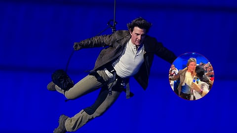 Tom Cruise is lowered on the Stade de France during the 2024 Summer Olympics closing ceremony; (inset) a woman grabbing actor and kissing him on the cheek.