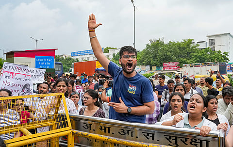 Doctors protest against the sexual assault and killing of a trainee doctor in Kolkata, near AIIMS in New Delhi.