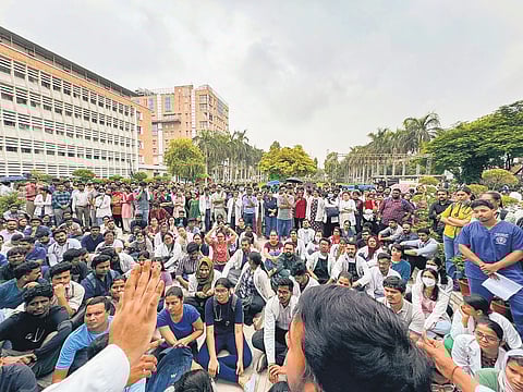 Medicos stage a protest against the sexual assault and murder of a postgraduate trainee doctor in Kolkata, at AIIMS, in New Delhi, on Monday