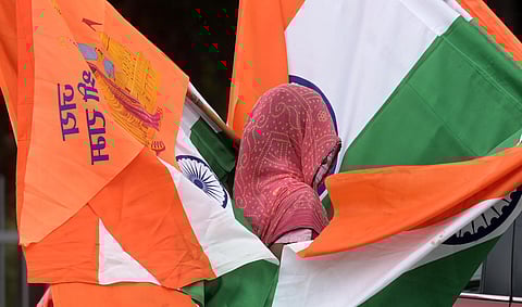 A vendor sells National flag in New Delhi.
