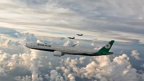 This handout photo taken and released by Taiwan's Military News Agency (MNA) on August 13, 2024 shows two US-made F-16V jet fighters of the Taiwanese air force escorting an EVA airline plane carrying Taiwanese medal-winning athletes as they fly home following their participation in the Paris 2024 Olympic Games.