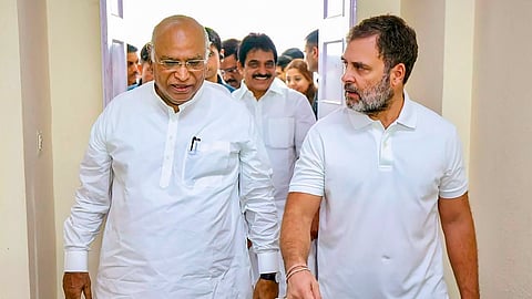 Congress President Mallikarjun Kharge with party leader Rahul Gandhi arrives to attend a meeting of the party's General Secretaries, State In-Charges, and State Presidents, in New Delhi.