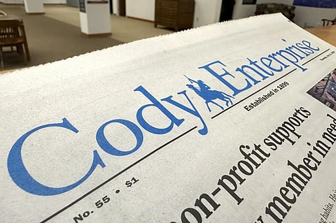 A recent issue of the Cody Enterprise, the Wyoming newspaper where a reporter used artificial intelligence to help write his stories, is seen Tuesday, Aug. 13, 2024, at the Wyoming State Library in Cheyenne.