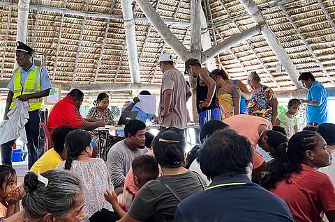 Voters gather at a polling station during Kiribati's national elections in Tarawa on August 14, 2024.