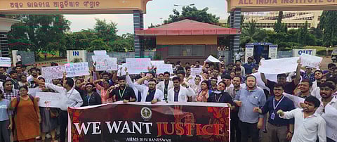 Resident doctors, interns and students of AIIMS-Bhubaneswar staging a demonstration on Wednesday (Photo | Express)