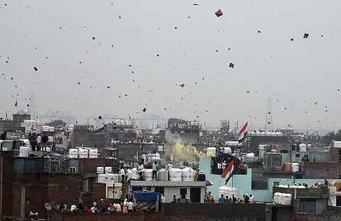 People fly kites from rooftops as they celebrate the 78th Independence Day in Old Delhi, on August 15, 2024.
