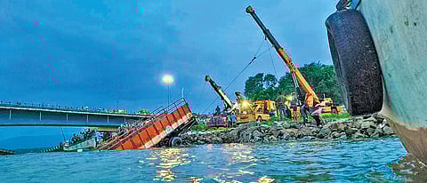 The truck being lifted from Kali River on the outskirts of Karwar on Thursday
