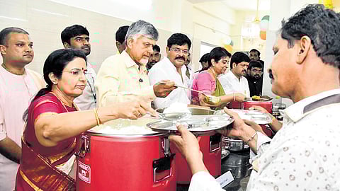 CM Nara Chandrababu Naidu along with his wife Bhuvaneswari seen serving food
to the people at Anna Canteen in Gudivada on Thursday