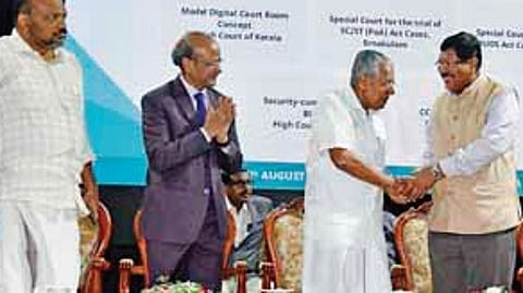Chief Minister Pinarayi Vijayan greeting Supreme Court judge Justice B R Gavai at a function at the Kerala High Court on Friday