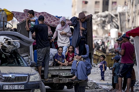 Palestinians displaced by the Israeli air and ground offensive on the Gaza Strip flee from Hamad City, following an evacuation order by the Israeli army to leave parts of the southern area of Khan Younis, Sunday, August 11, 2024.