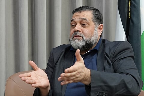 Hamas political official Osama Hamdan speaks during an interview with The Associated Press in Doha, Qatar, Tuesday Aug. 13, 2024.