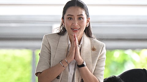 Pheu Thai party leader Paetongtarn Shinawatra, and daughter of former prime minister Thaksin Shinawatra, greets members of the media at local news outlet Voice TV in Bangkok on August 16, 2024.