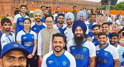Union Minister Kiren Rijiju with Paris Olympics medallists; shooters Manu Bhaker, Sarabjot Singh and Swapnil Kusale, wrestler Aman Sehrawat and the Indian men's hockey players, during the 78th Independence Day celebration at the Red Fort, in New Delhi, Thursday, Aug. 15, 2024.