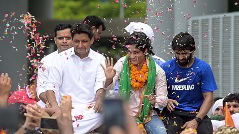 Wrestler Vinesh Phogat with wrestlers Bajrang Punia, Sakshi Malik and Congress MP Deepender Singh Hooda poses for photos on her arrival after Paris Ol