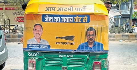AAP poster for Lok Sabha 2024 polls pasted at the rear of auto-rickshaw