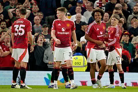 Manchester United's Joshua Zirkzee, second right, celebrates after scoring the opening goal during the English Premier League football match between Manchester United and Fulham at Old Trafford.