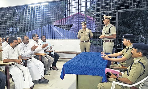 Ernakulam district police chief Vaibhav Saxena with local representatives during
his station visit