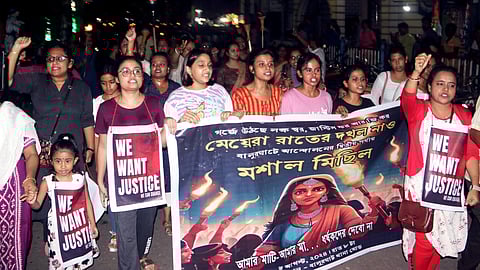Women march during a protest against the alleged rape and murder of a woman doctor at Kolkata' s RG Kar Medical College and Hospital at Balurghat,