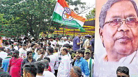 Congress workers protest against Governor Thaawarchand Gehlot for granting permission to prosecute CM Siddaramaiah in Bengaluru’s Freedom Park on Monday