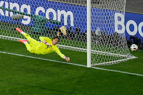 Switzerland's goalkeeper Yann Sommer dives to attempt a save during a quarterfinal match between England and Switzerland at the Euro 2024.