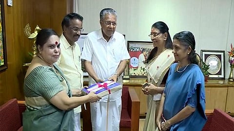 Kerala CM Pinarayi Vijayan receiving the report of the Hema Commission from Retired Justice K Hema.