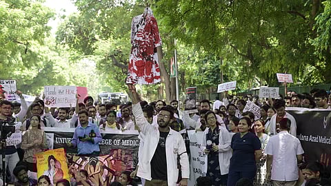 Doctors stage a protest march outside the Health Ministry against the brutal rape and murder of a postgraduate trainee doctor at Kolkata's RG Kar Hospital in New Delhi.