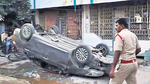 An overturned car and the ransacked furniture in a house following a clash between TDP and YSRC cadres in Tadipatri on Tuesday