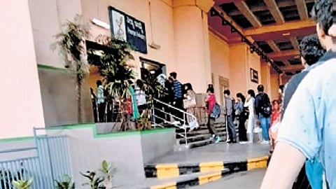 Commuters queue up at Peenya Industry Metro station on Tuesday morning