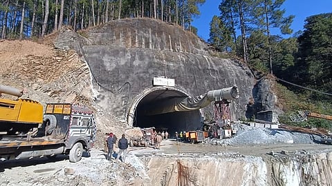 Workers gather near Silkyara tunnel Uttarakhand.