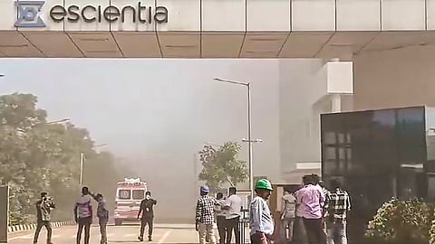People gather outside the reactor pharma unit of pharmaceutical company Escientia where a fire broke out following an explosion, in Anakapalle, Andhra Pradesh.