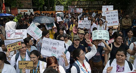 Doctors stage a protest against the brutal rape and murder of a postgraduate trainee doctor at Kolkata s RG Kar Hospital, at Jantar Mantar in New Delhi on Wednesday.