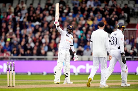 Sri Lanka's Milan Rathnayake celebrates reaching his half century on day one of the First Test match between England and Sri Lanka.