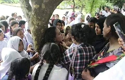 Geetanjali Barua being tied to a tree by her students (Photo | Special arrangement)