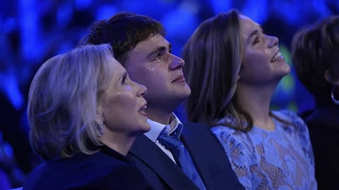 Gwen Walz, Gus Walz and Hope Walz, wife, son and daughter of Democratic vice presidential nominee Minnesota Gov. Tim Walz, watch during the Democratic National Convention.