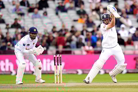 England's Jamie Smith, right, in action during day two of the First Test match between England and Sri Lanka at Emirates Old Trafford.