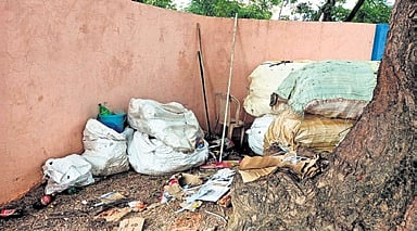 Bags of trash piled up at the Government Primary School in Kattarampur, Karimnagar