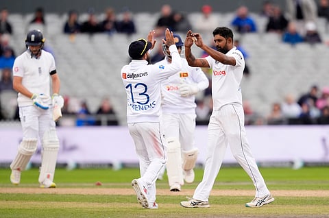 Sri Lanka's Prabath Jayasuriya celebrates after dismissing England's Harry Brook during day two of the First Test match between England and Sri Lanka at Emirates Old Trafford, Manchester.
